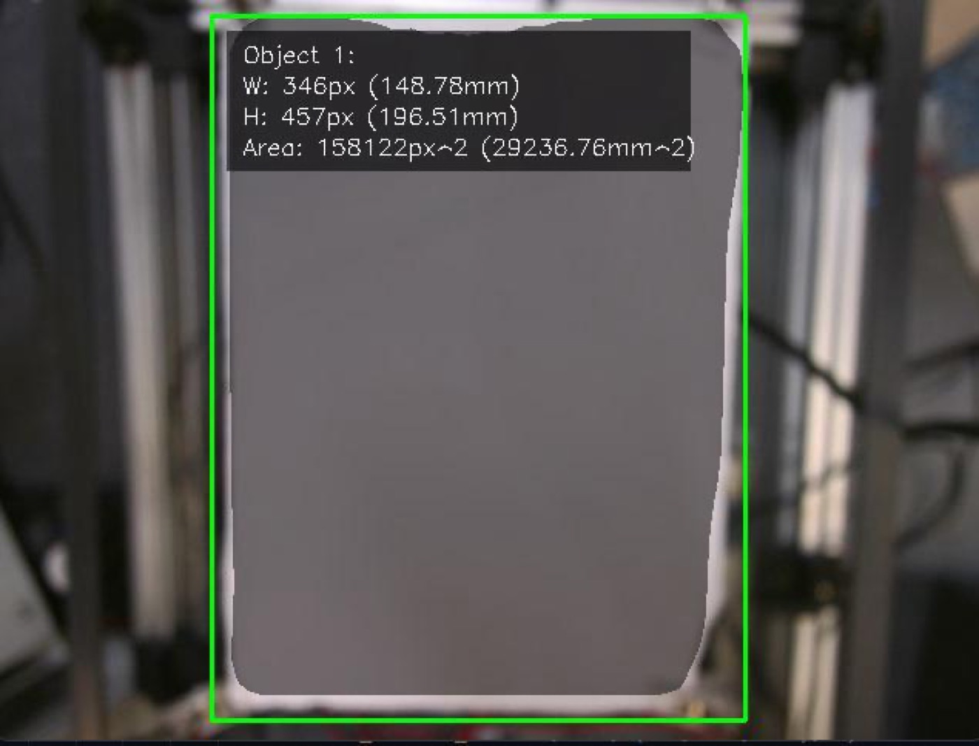 Computer vision overlay by 3AXIS reporting an object's width, height and area in pixels and millimetres